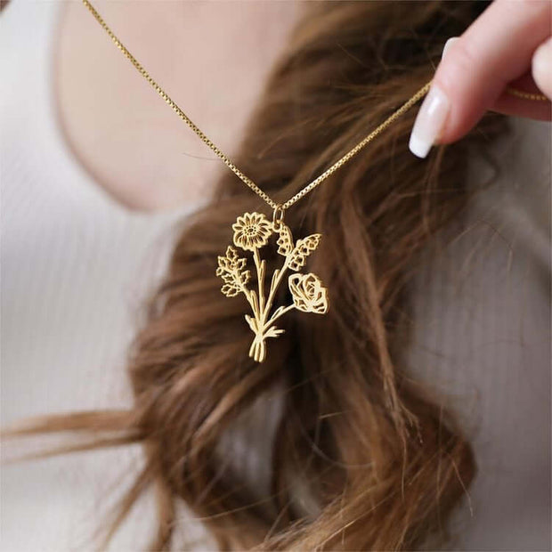Multiple Birth Flower NecklaceEmbrace the beauty of family and nature with our exquisite Multiple Birth Flower Necklace. Each pendant is delicately crafted to represent the unique birth flowers of your loved ones, creating a personal bouquet that rests cl